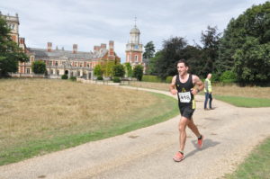 Runners in the Great Yarmouth Half Marathon running past Somerleyton Hall