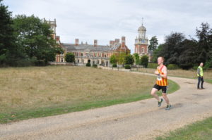 Runners in the Great Yarmouth Half Marathon running past Somerleyton Hall