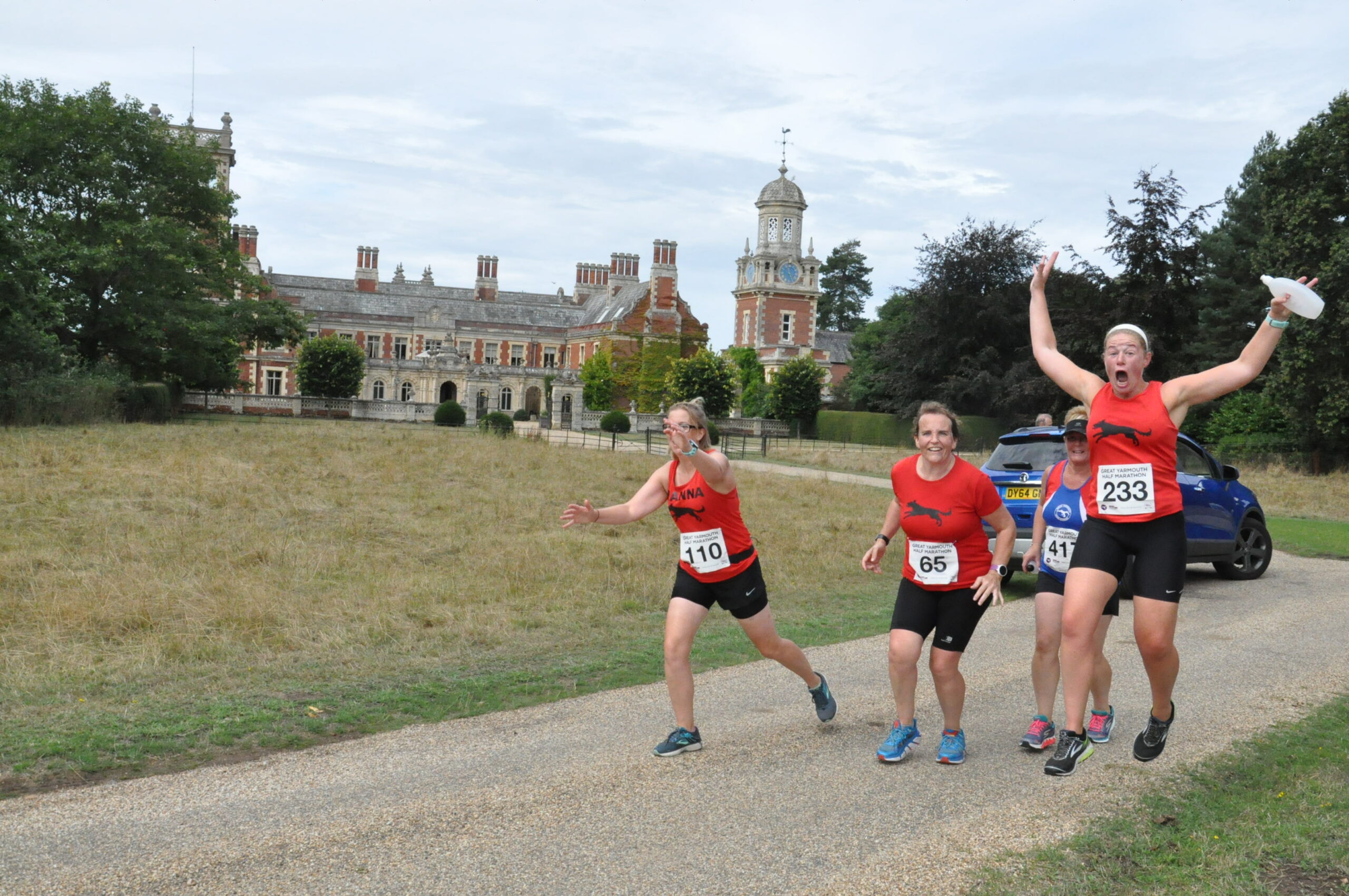 Runners in great yarmouth half marathon running past Somerleyton Hall